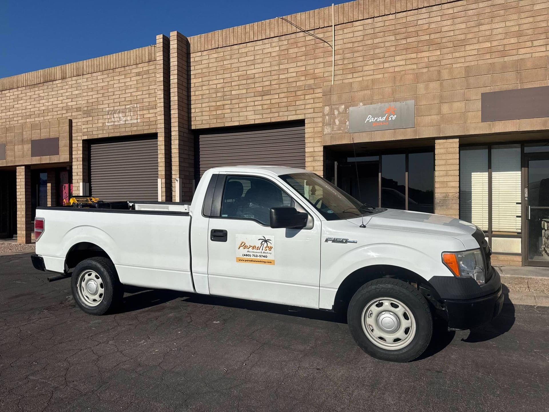 A Paradise Washing work truck parked outside the Tempe shop