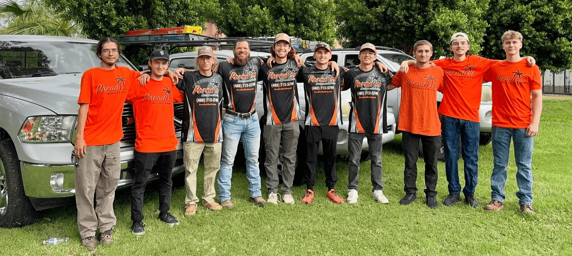 The Paradise Washing team in front of their work trucks